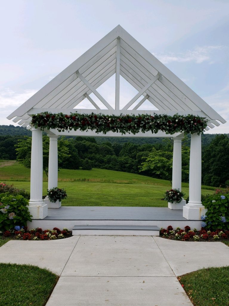 Springfield Manor Pergola Arrangement Blossom & Basket Boutique